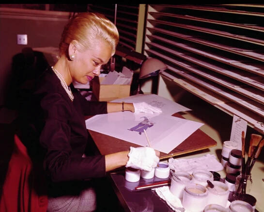 Layout artist Sylvia Roemer painting Merlin on celluloid